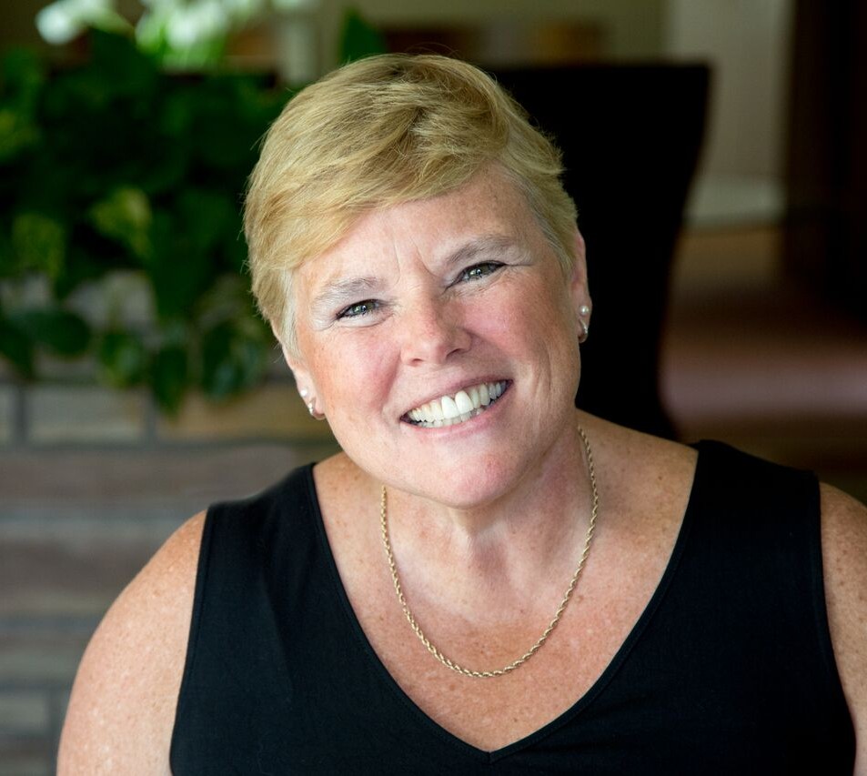 Sandra Hanmer smiling in a black dress